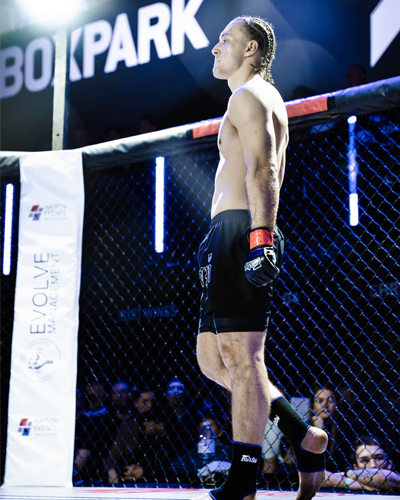 Josh Kelly competing in mixed martial arts